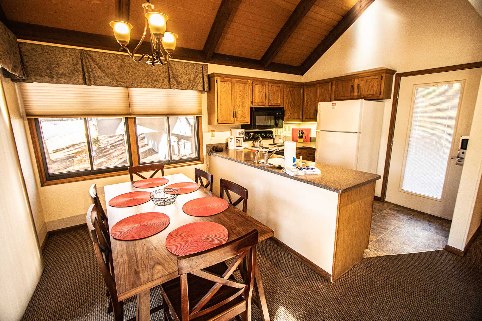 A spacious dining and kitchen area at VRI's Mountain Loft Resort in North Carolina.